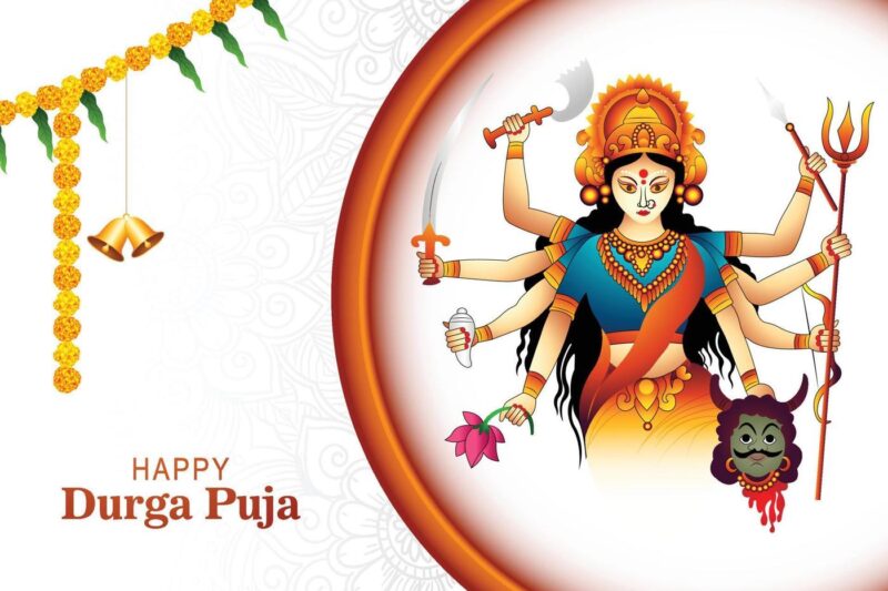 Durga Puja 2025 idol in a beautifully decorated pandal with devotees celebrating and traditional Bengali sweets displayed